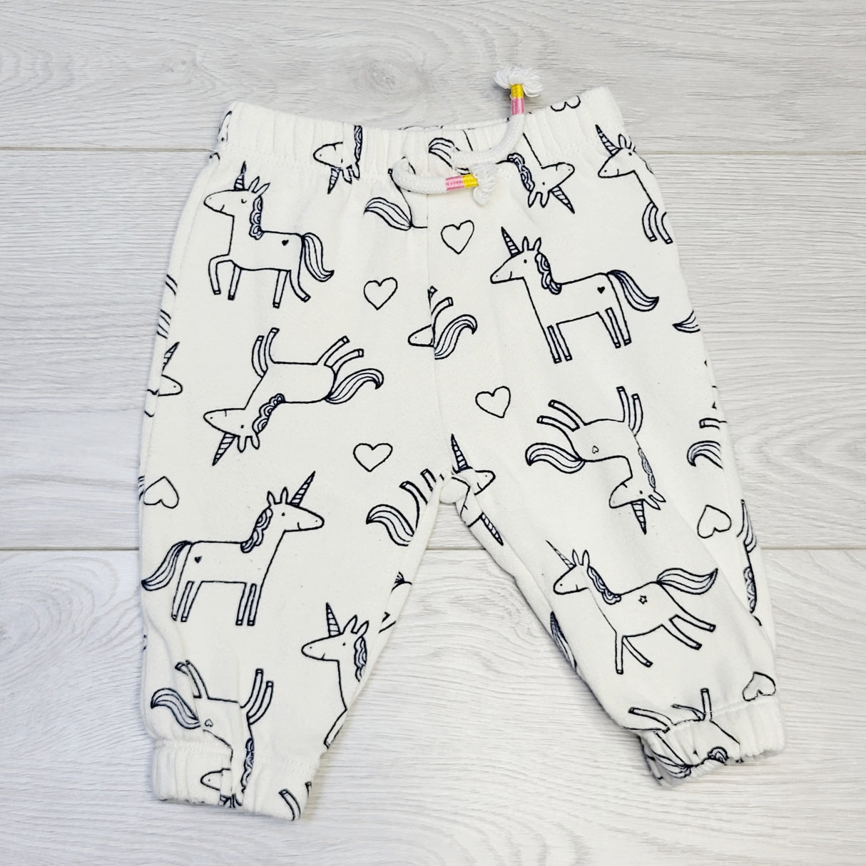 COWN1 - Joe cream coloured sweat pants with unicorns.  Size 3-6 months