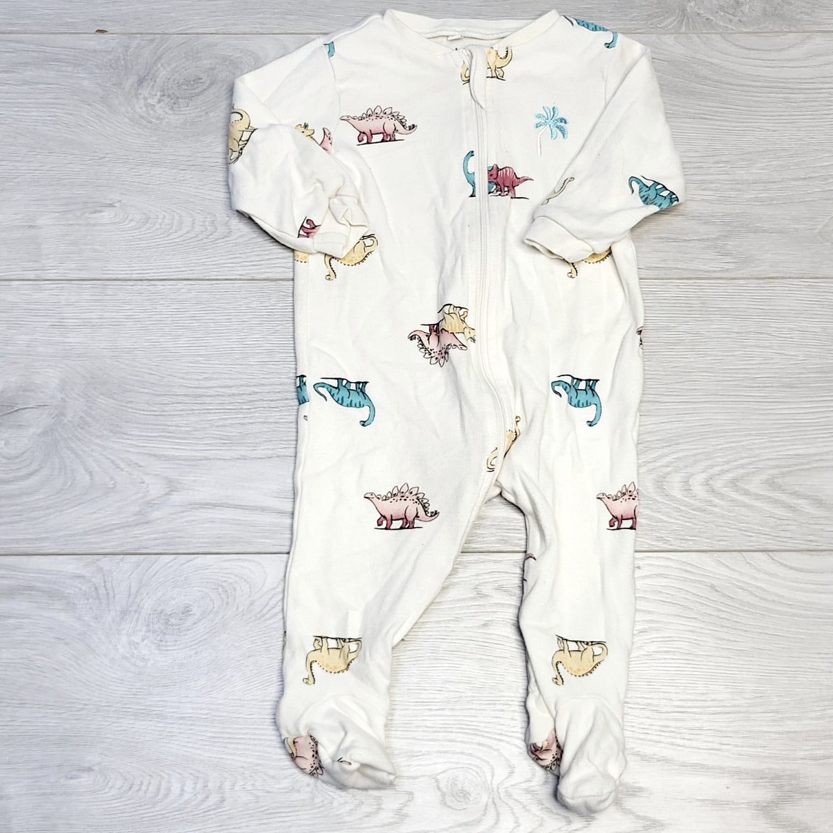COWN1 - Pekkle cream coloured zippered cotton sleeper with dinosaurs. Size 6 months