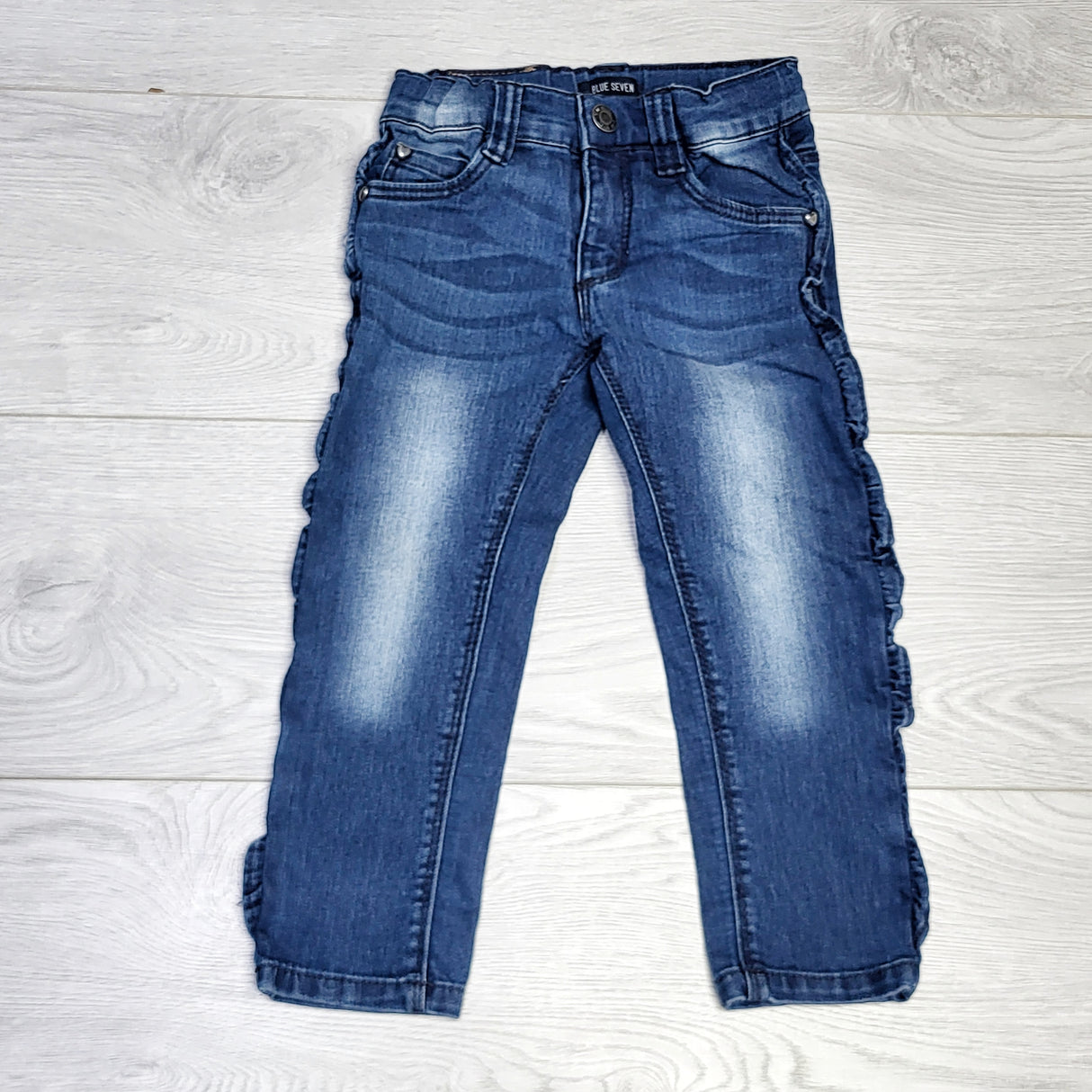 KJHN1 - Blue Seven distressed jeans with side ruffles. Size 2T