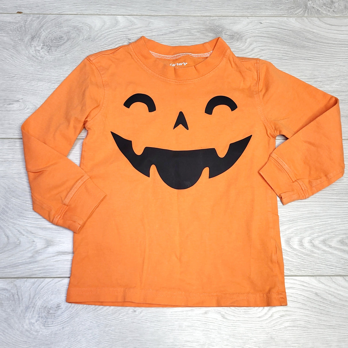 KJHN2 - Carters orange Jack-o-lantern long sleeved shirt. Size 2T