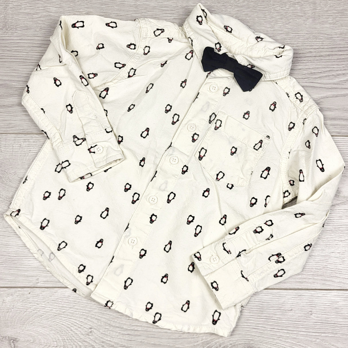 RBEN1 - Joe cream coloured button down top with penguins and removable bow tie. Size 2T