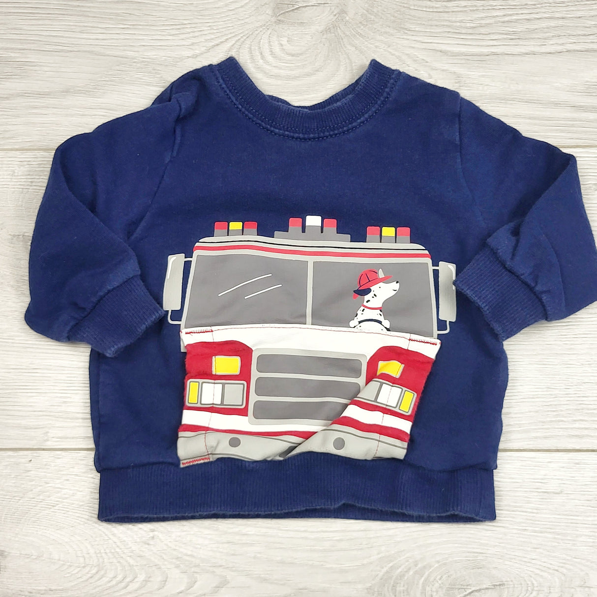 RBEN2 - Carters navy sweatshirt with fire truck. Size 6 months