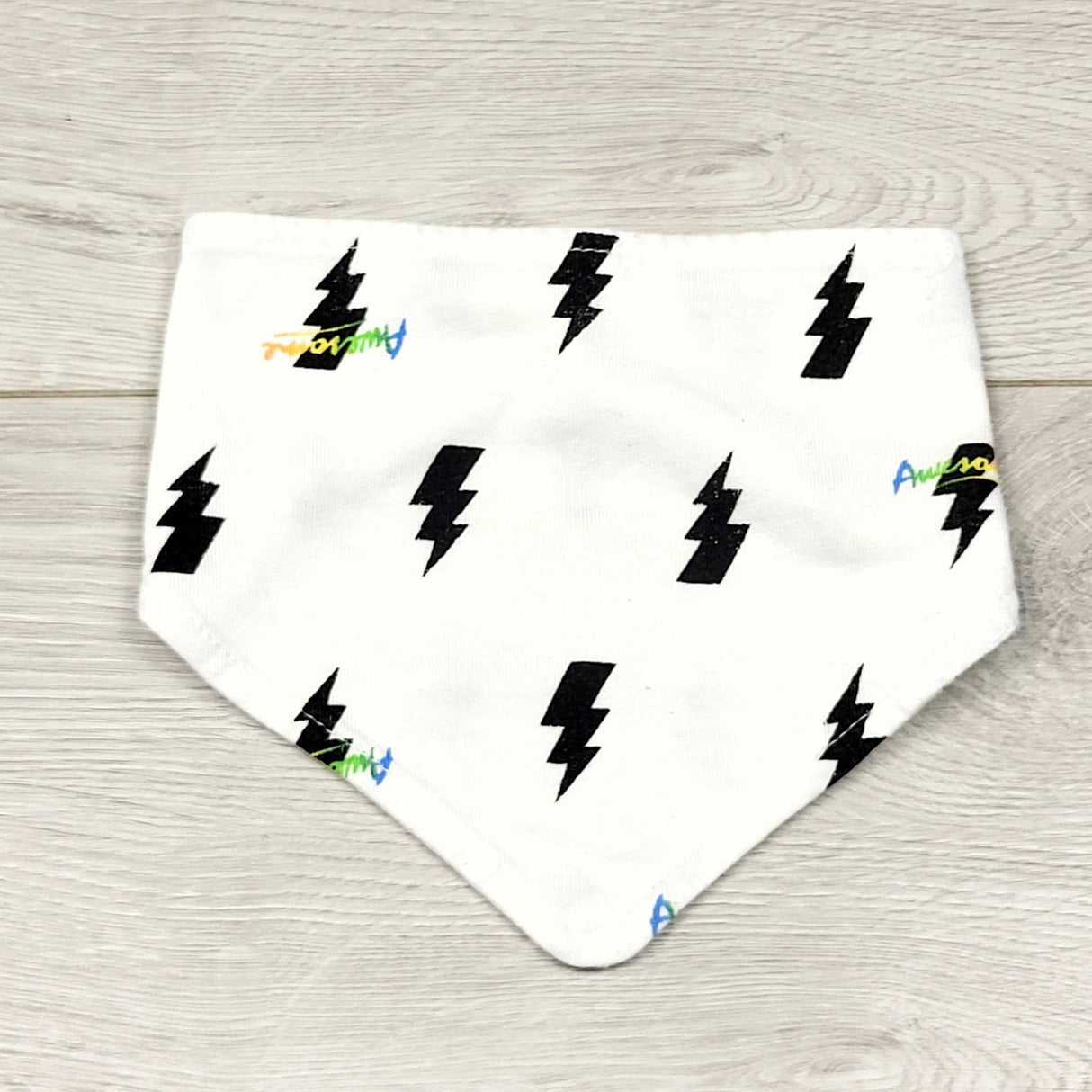 KWTT1 - White cotton bib with lightening bolts