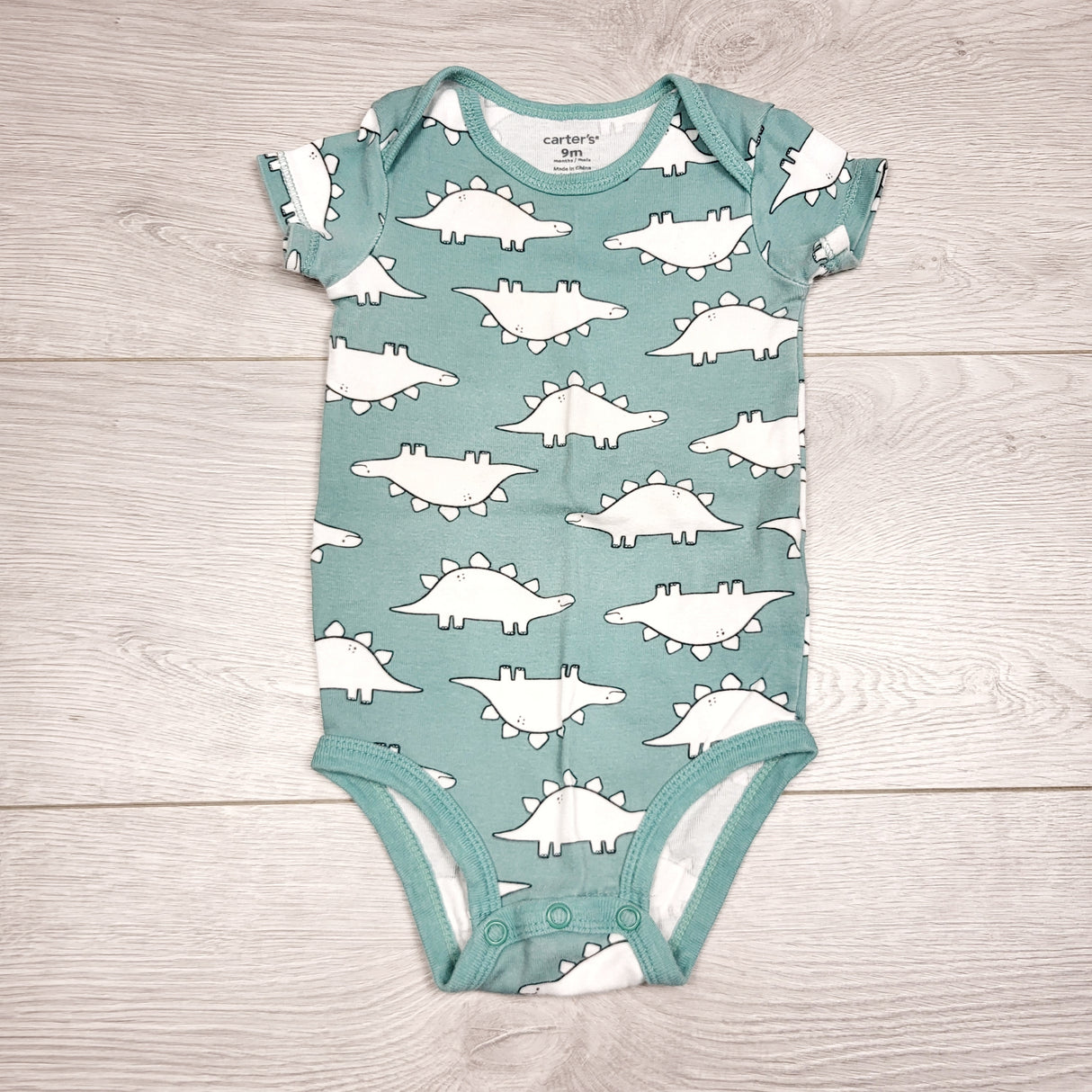 KWTT2 - Carters teal bodysuit with dinosaurs. Size 9 months