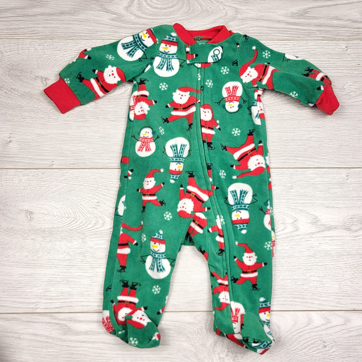 KWTT22 - Carters green zippered fleece sleeper with Santas. Newborn size