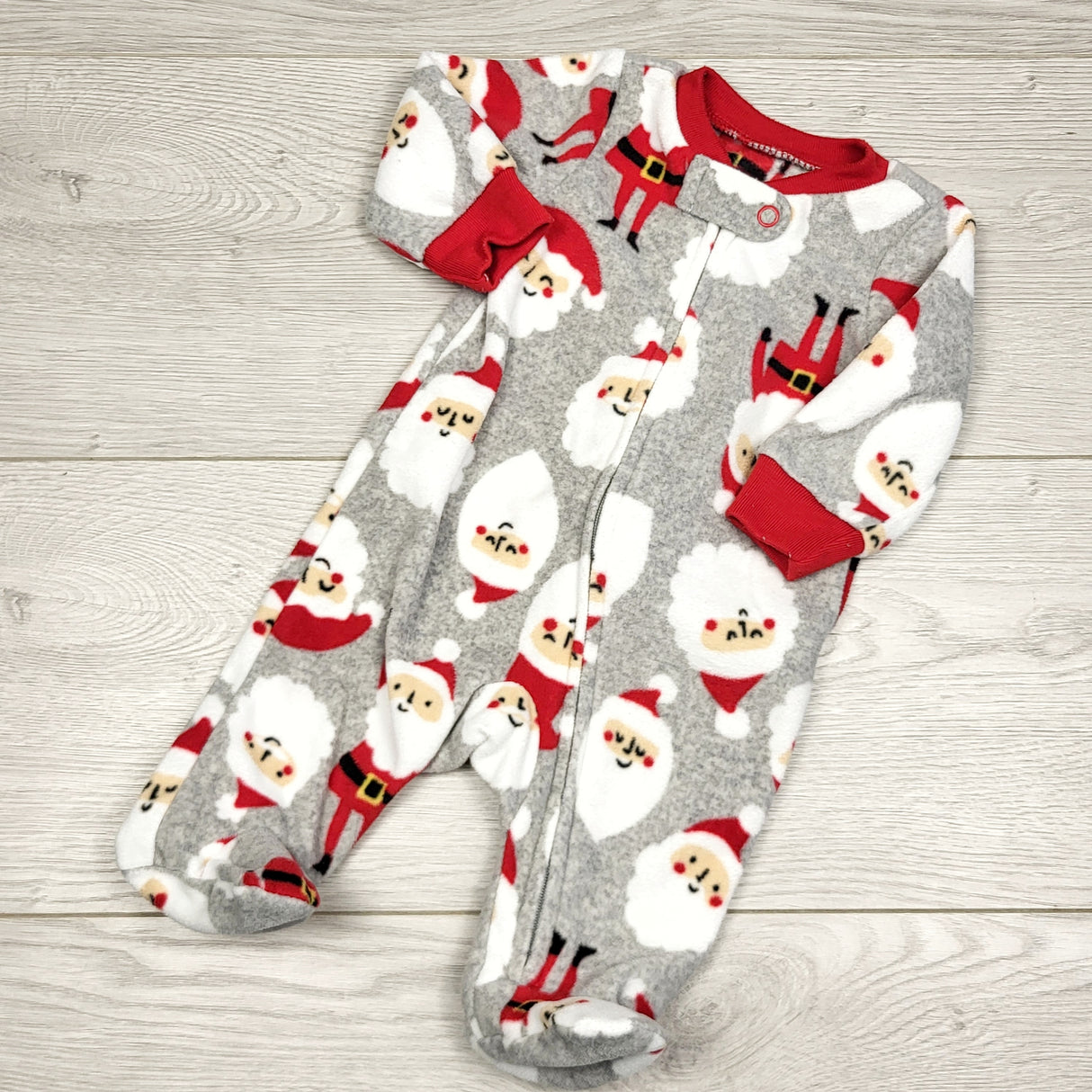 KWTT22 - Carters grey zippered fleece sleeper with Santas. Newborn size