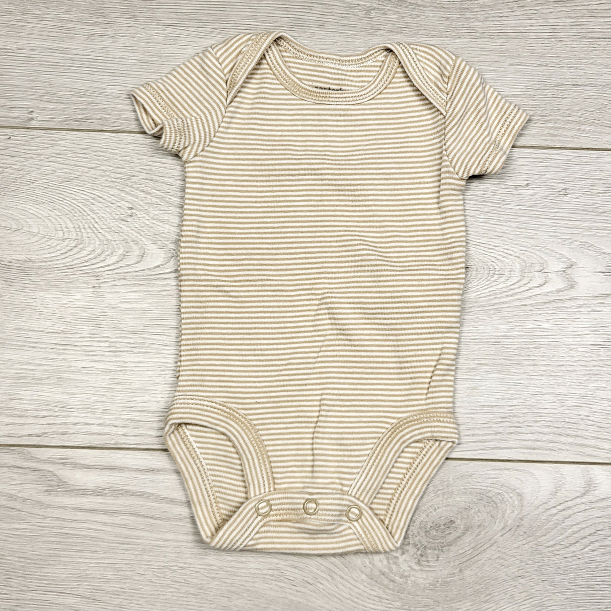 KWTT22 - Carters beige striped bodysuit. Newborn size