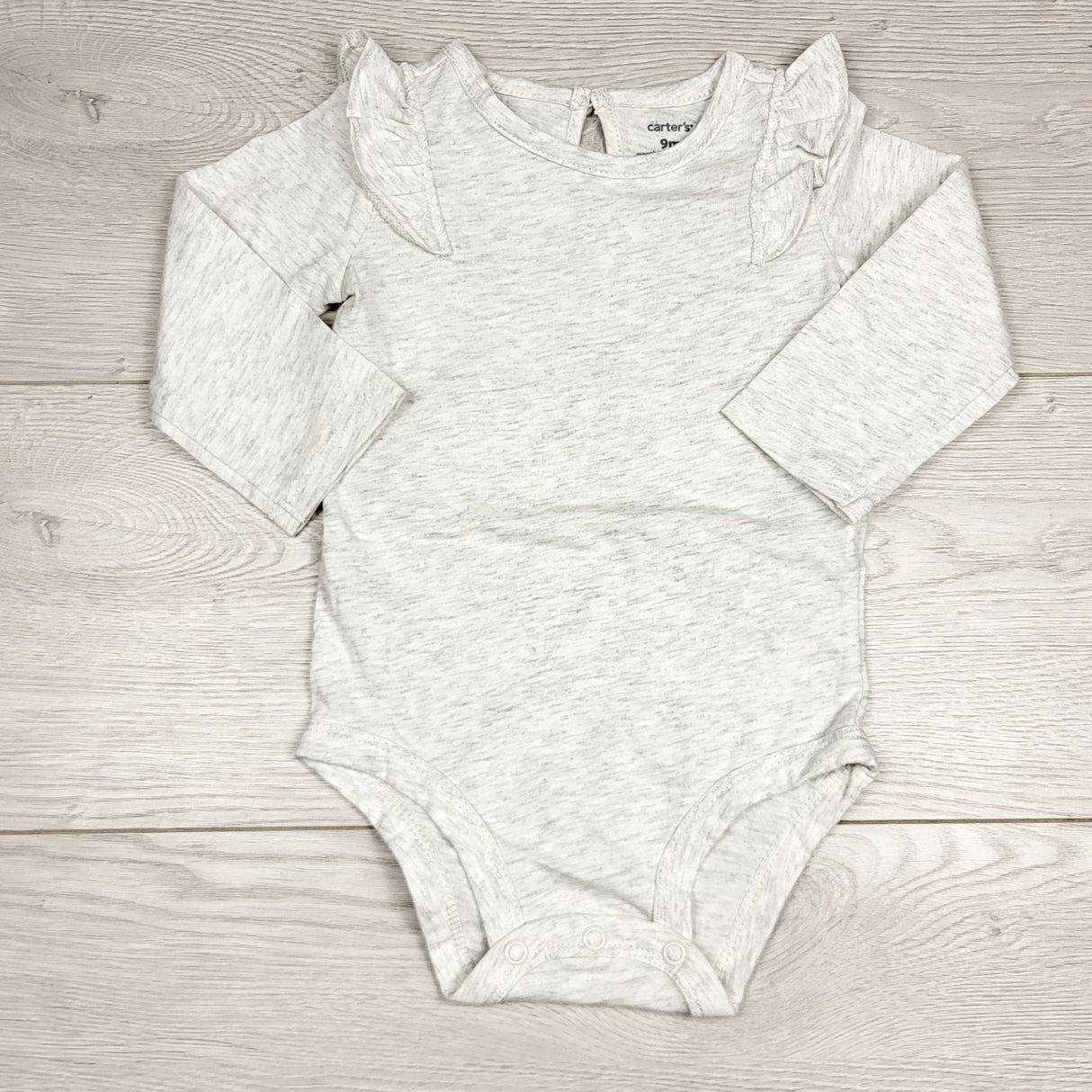 MBLK11 - Carters grey long sleeved bodysuit with ruffles. Size 9 months