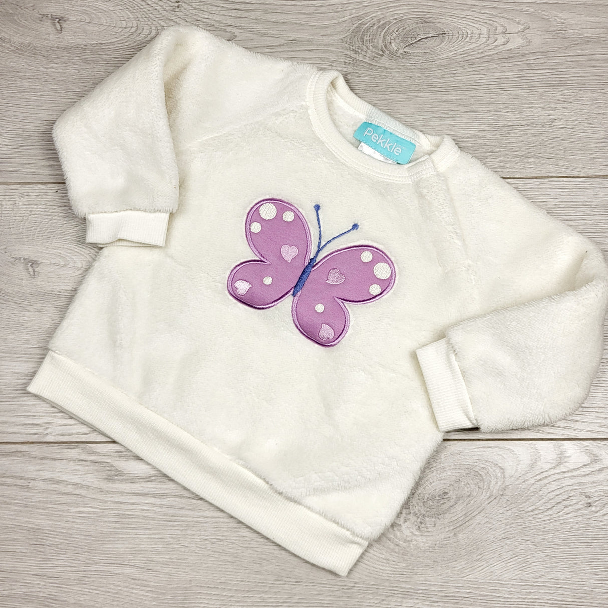 MBLK11 - Pekkle white fuax fur sweatshirt with butterfly. Size 9 months