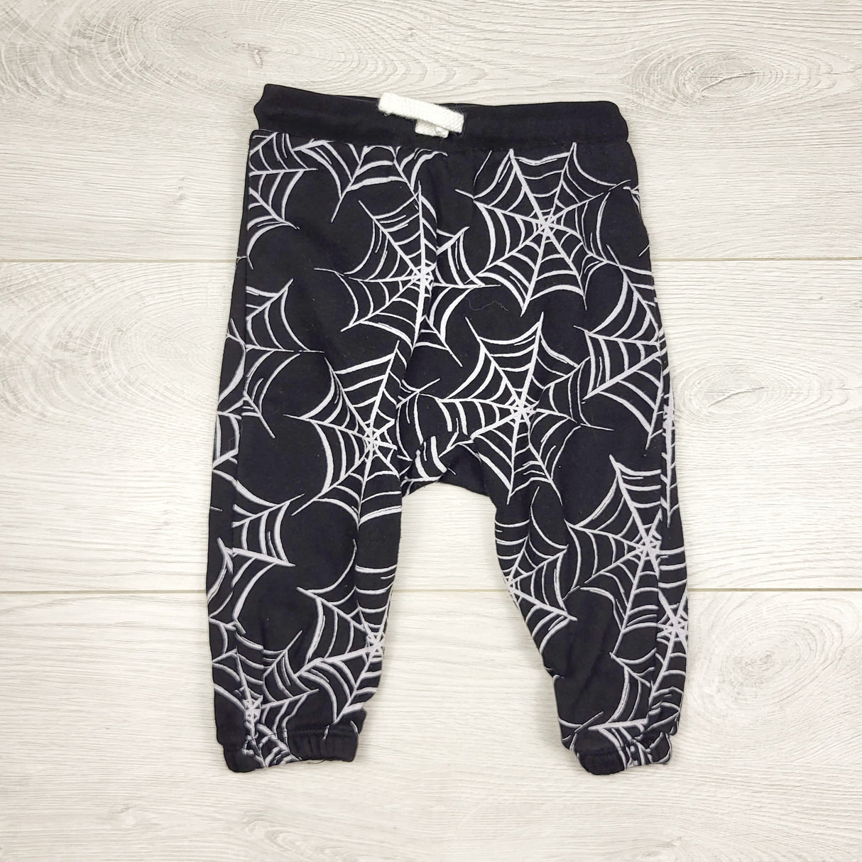 MIRE3 - Old Navy black fleecy lined pants with spider webs. Size 6-12 months