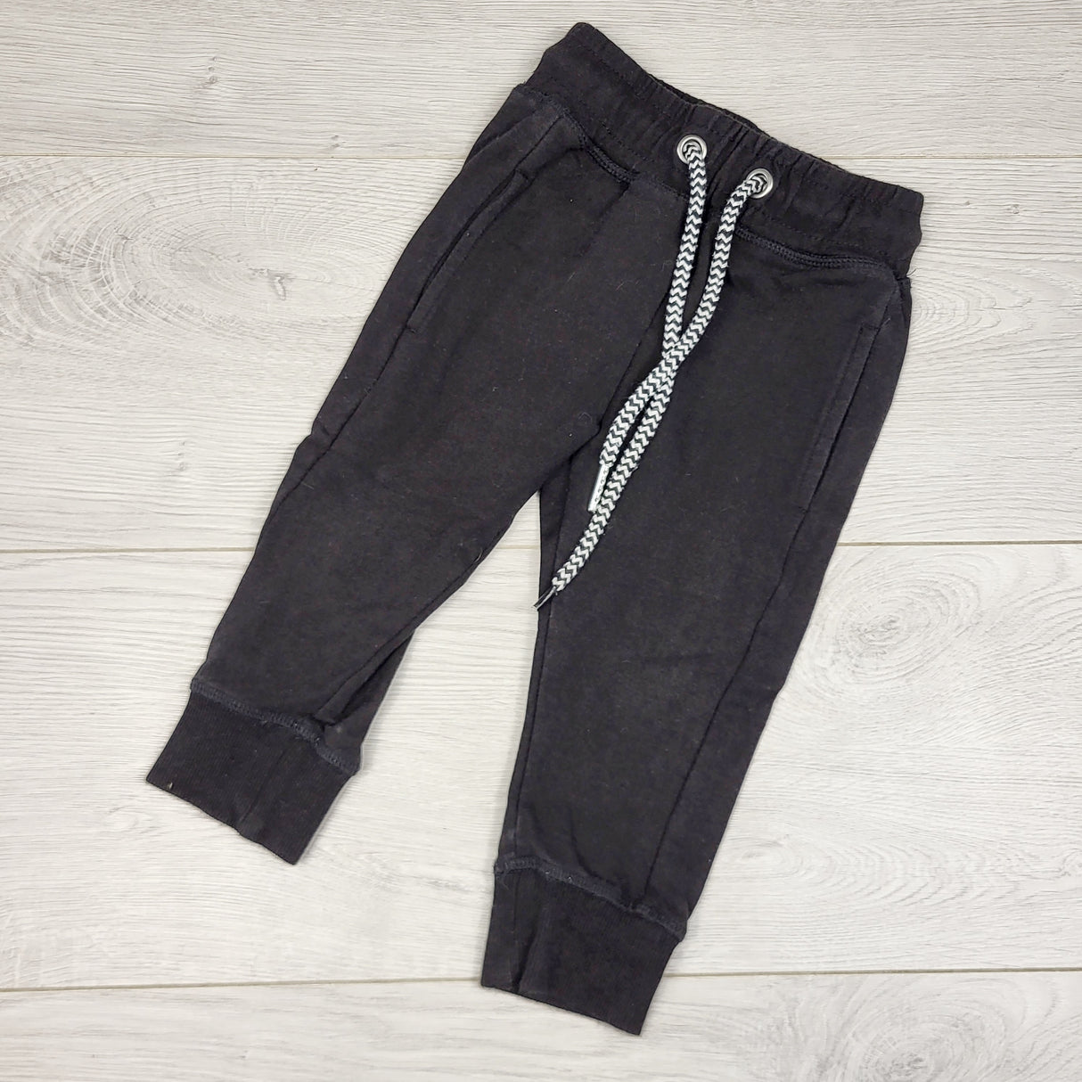 MIRE4 - Whistle and Flute black bamboo blend drawstring joggers. Size 12-18 months