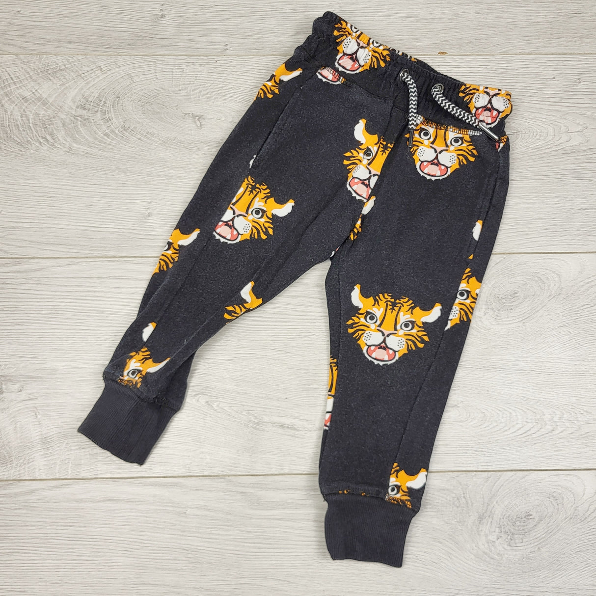 MIRE4 - Whistle and Flute black bamboo blend drawstring joggers with tigers. Size 12-18 months