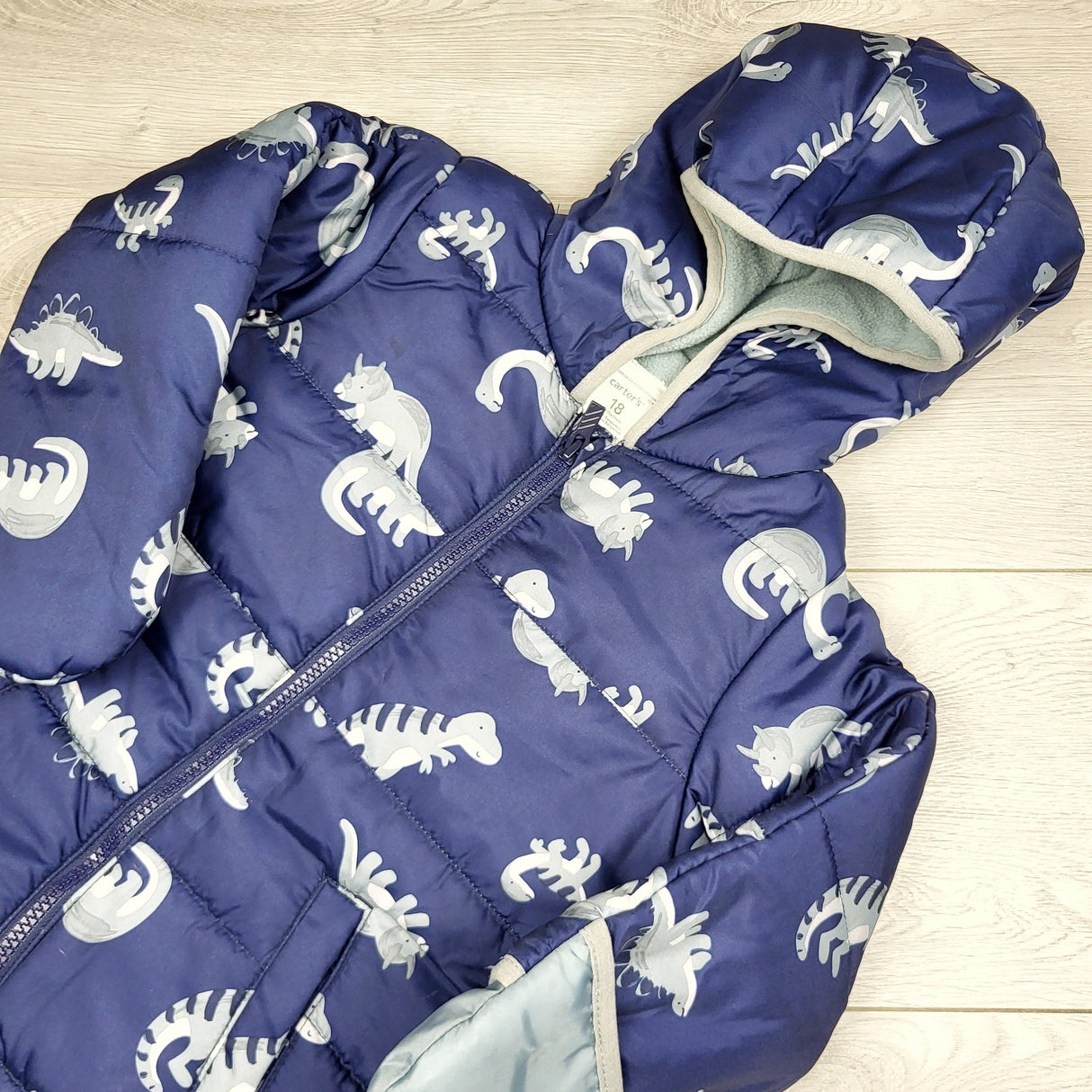 AWAT1 - Carters navy fleece lined water resistant bunting suit / snowsuit with dinosaurs. Size 18 months