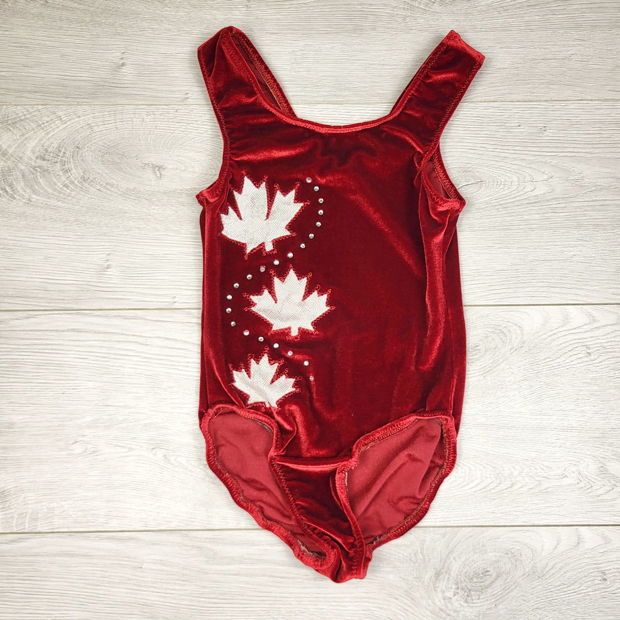 AWAT1 - Red velvet gymnastics suit with maple leaves. Approx 4T