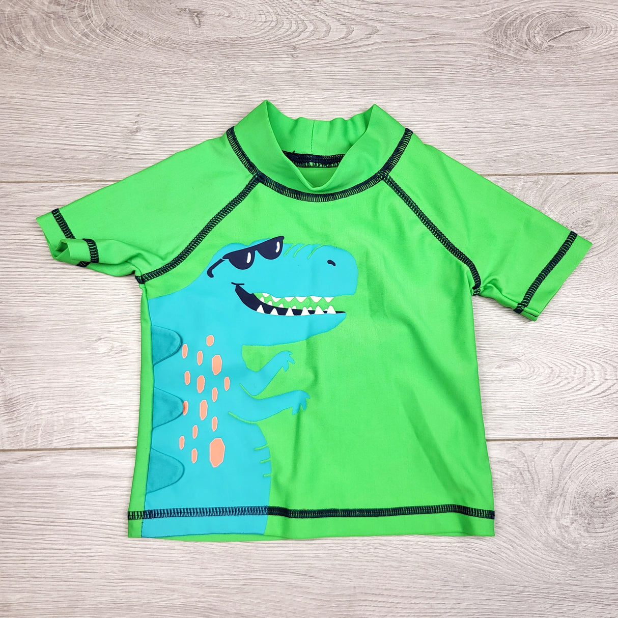 AWAT1 - Carters green rash guard with dinosaur. Size 6 months