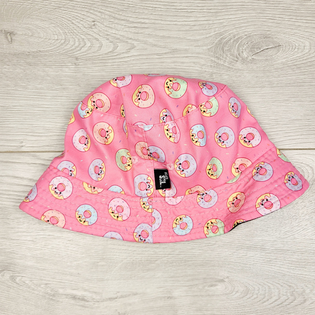 AWAT1 - Kids Sol pink donut bucket hat. Approx 12-24 months