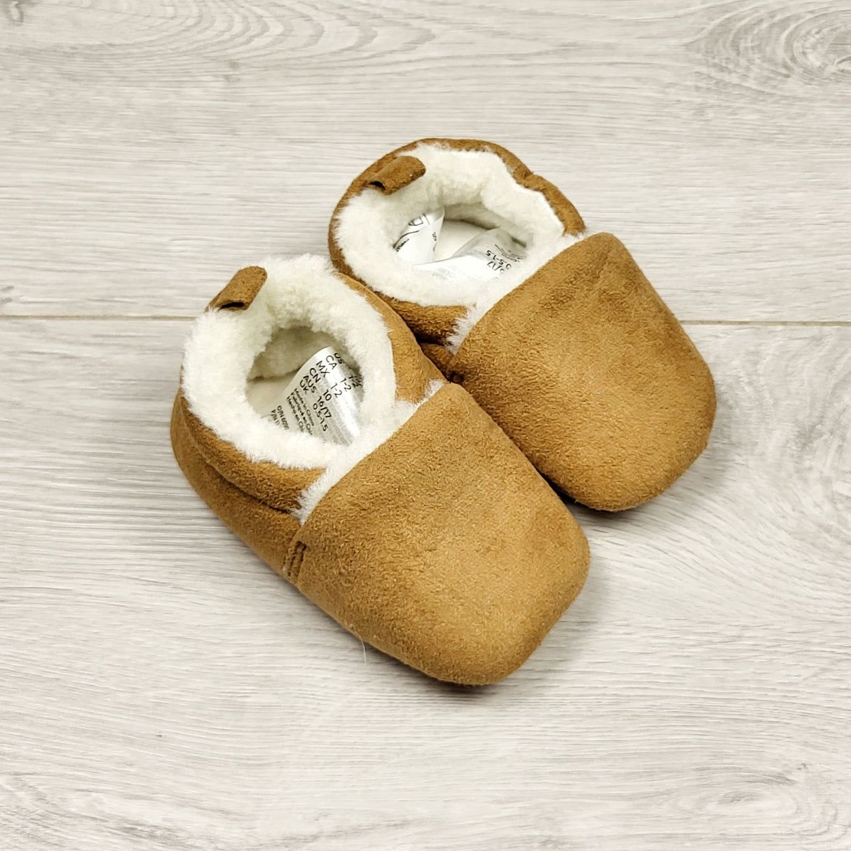 ECRS1 - H and M tan faux fur lined slippers. Infant size 1/2