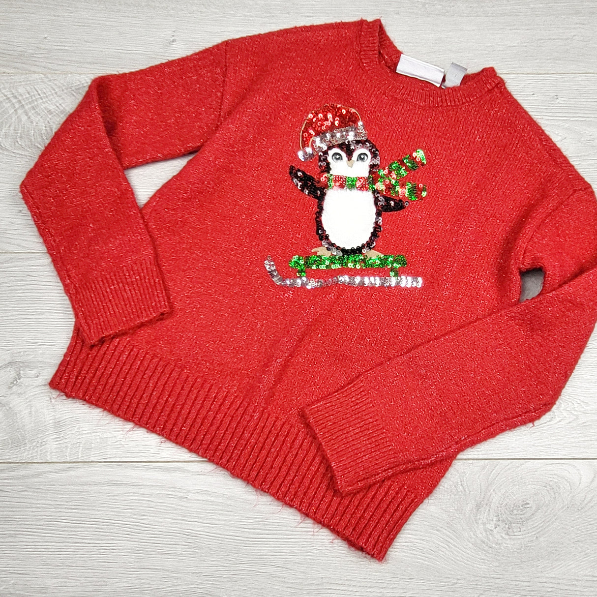 RMAZ2 - Children's Place red sparkly sweater with sequin penguin. Size 5/6