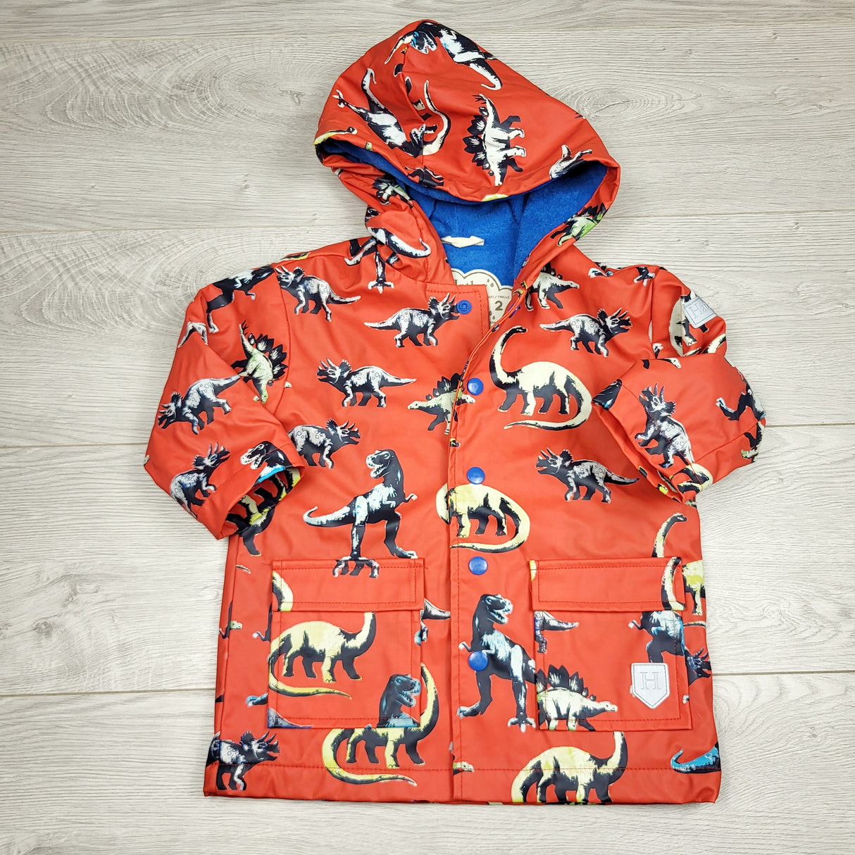 RMAZ2 - Hatley red colour changing dinosaur rain coat. Size 2T