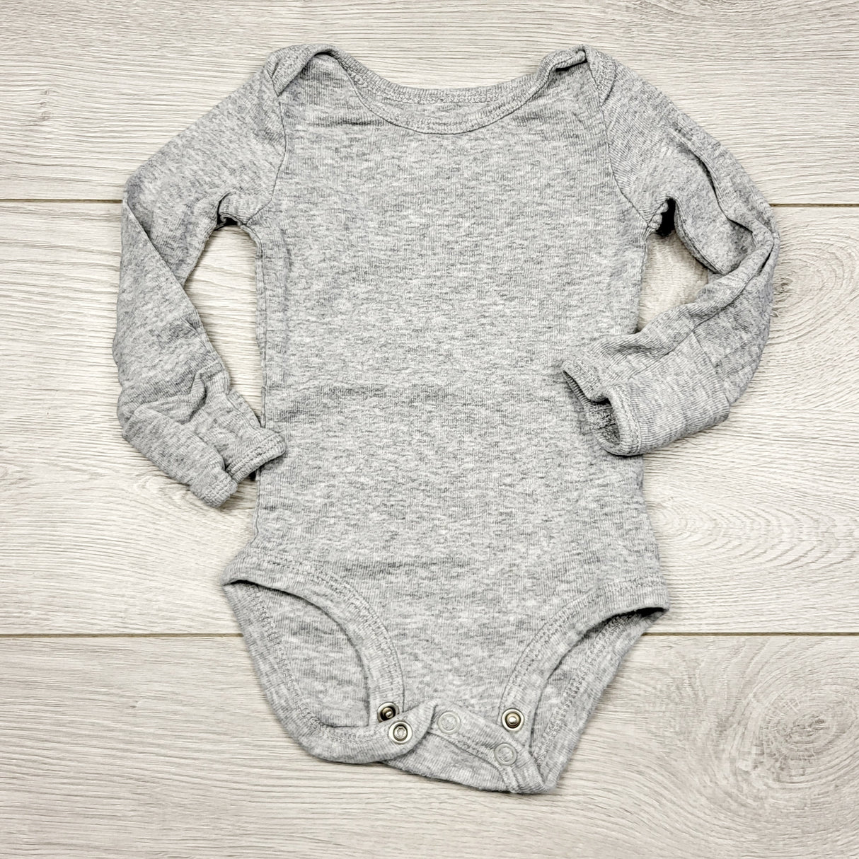 ECRS3 - Carters grey long sleeved bodysuit. Newborn size