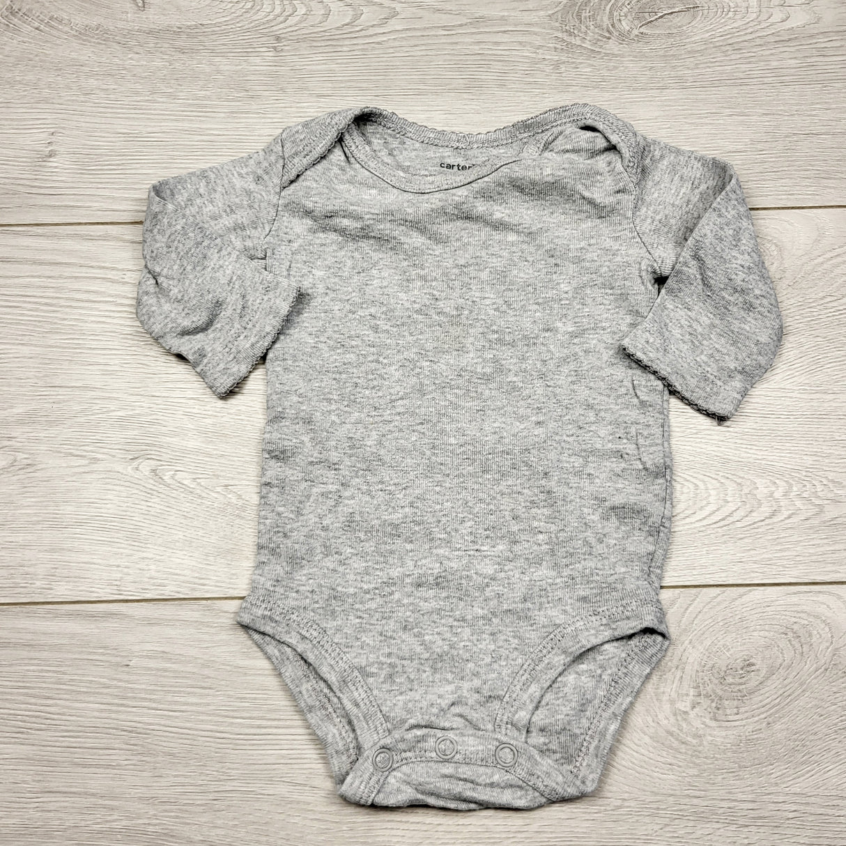 ECRS31 - Carters grey long sleeved bodysuit. Size 3 months