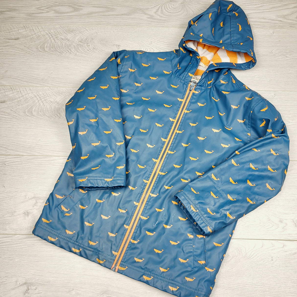 DPAR3 - Hatley teal terrycloth lined rain jacket with whales. Size 7.