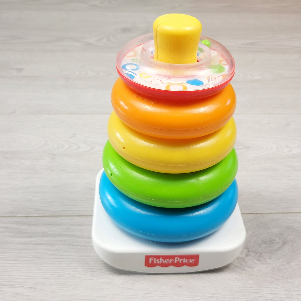 RBRSN1 - Fisher Price plastic stacking ring toy.