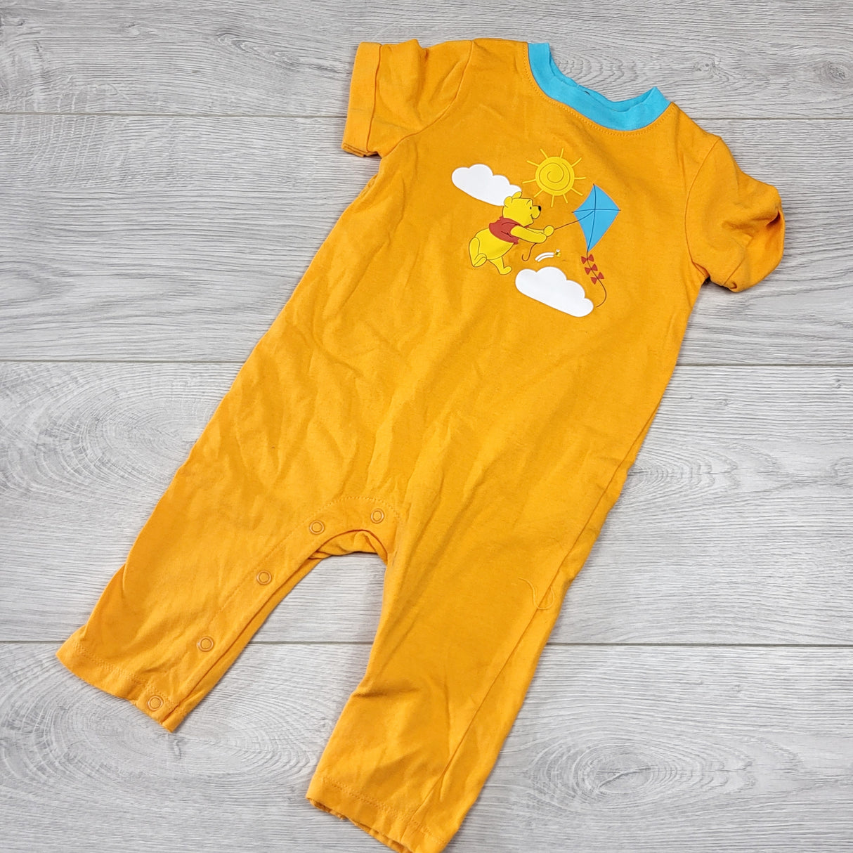 LMAC1 - Joe orange cotton Winnie the Pooh romper. Size 6-12 months