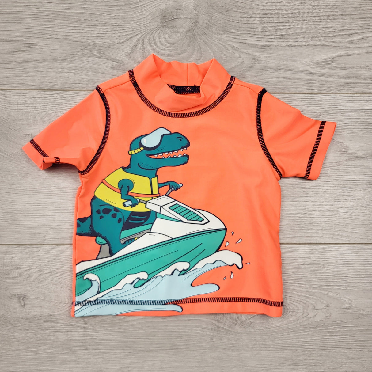 LMAC1 - Carters neon orange rash guard with dinosaur. Size 6 months