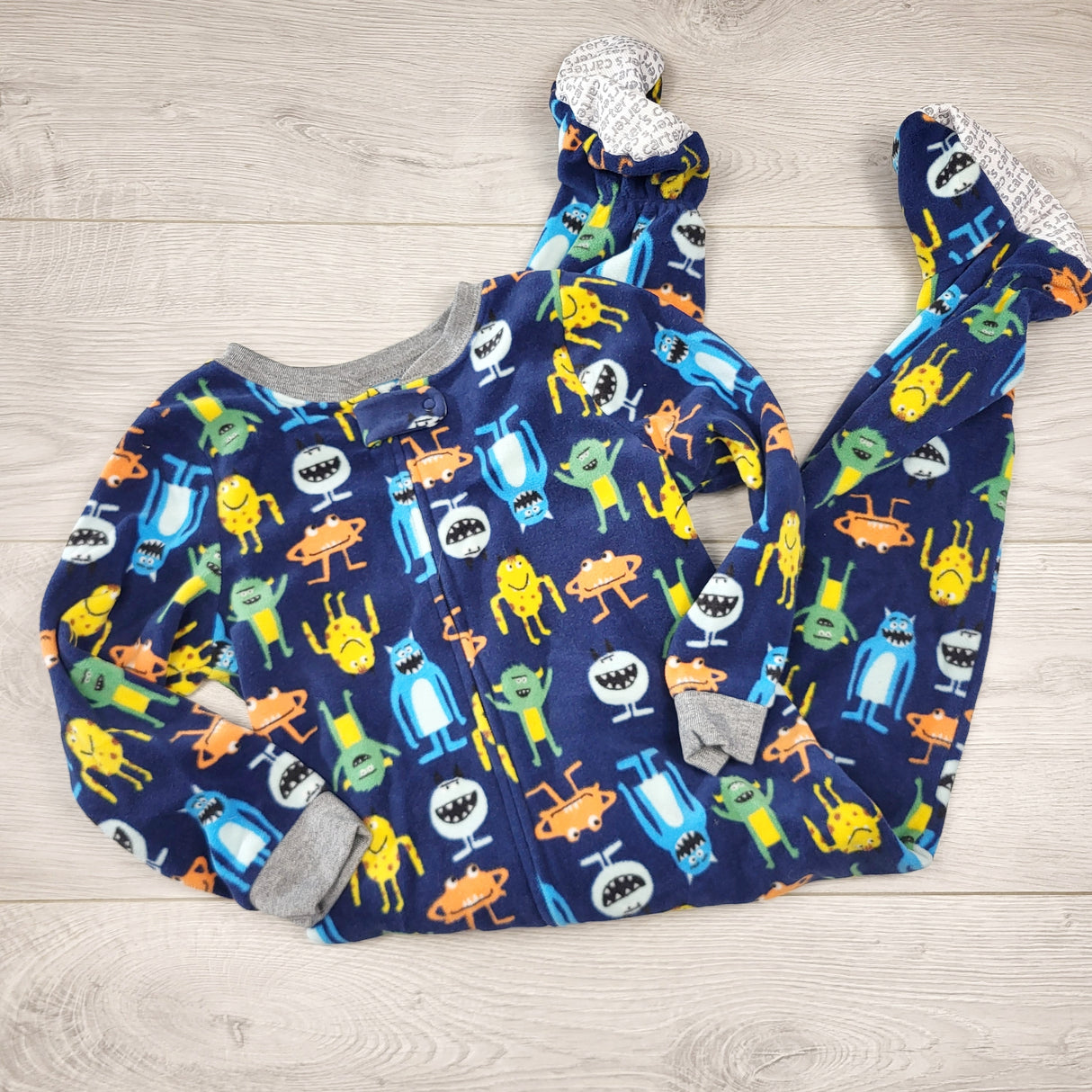 RBRSN2 - Carters navy zippered fleece sleeper with monsters. Size 3T