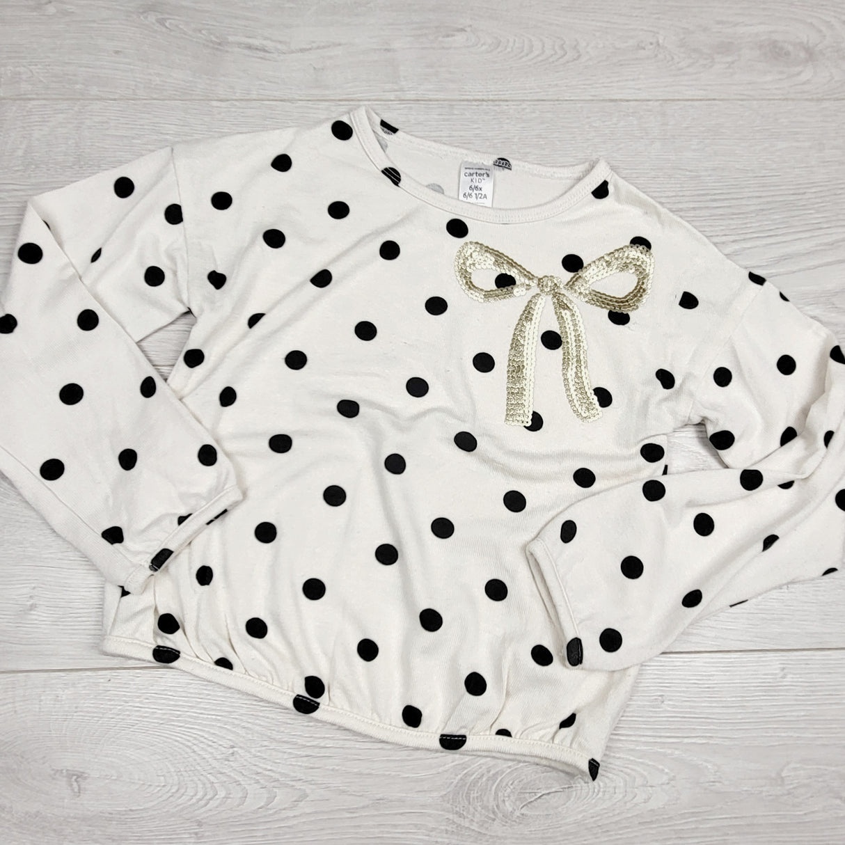 VBSH1 - Carters knit polka dot top with sequin bow. Size 6/6X