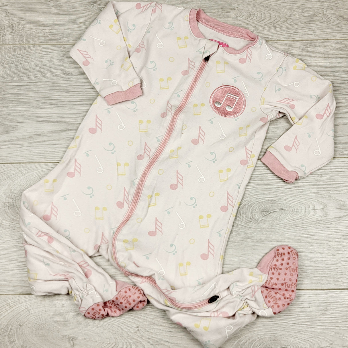 ECRS44 - Tuffy pink zippered cotton sleeper with musical notes. Size 12 months