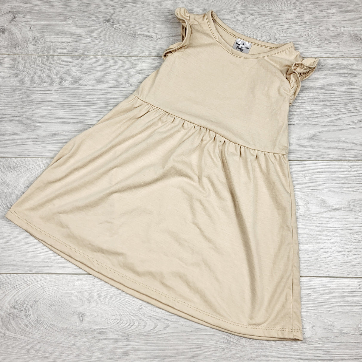 CKFT1 - Blanks Blanks Baby beige dress with ruffles. Size 3T