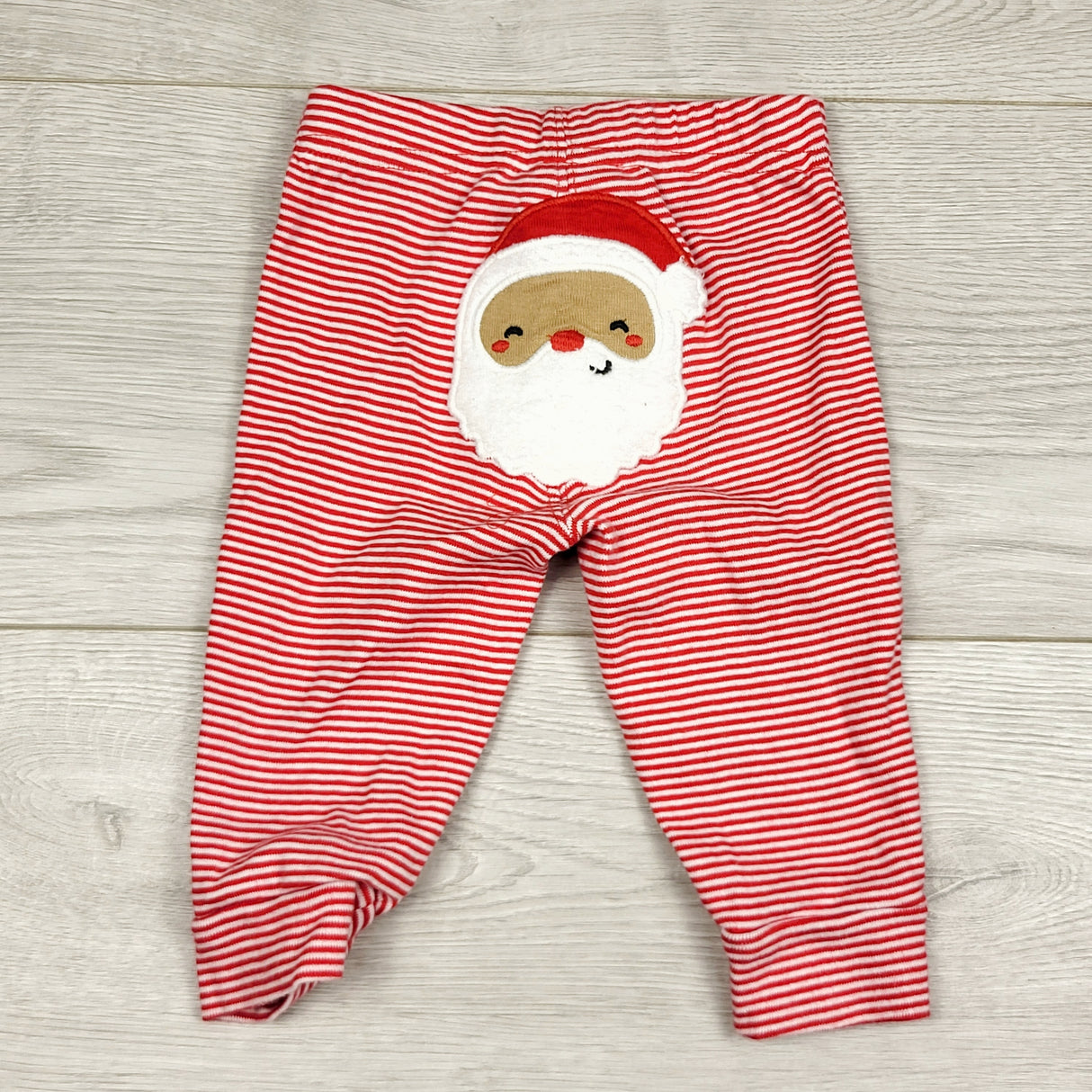 COWN1 - Carters red striped cotton pants with Santa bum. Size 6 months