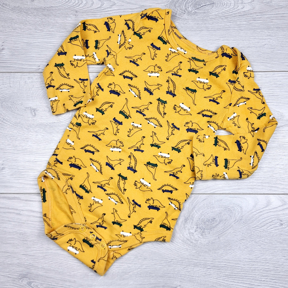 LMAC22 - Joe yellow bodysuit with dinosaurs. Size 6-12 months