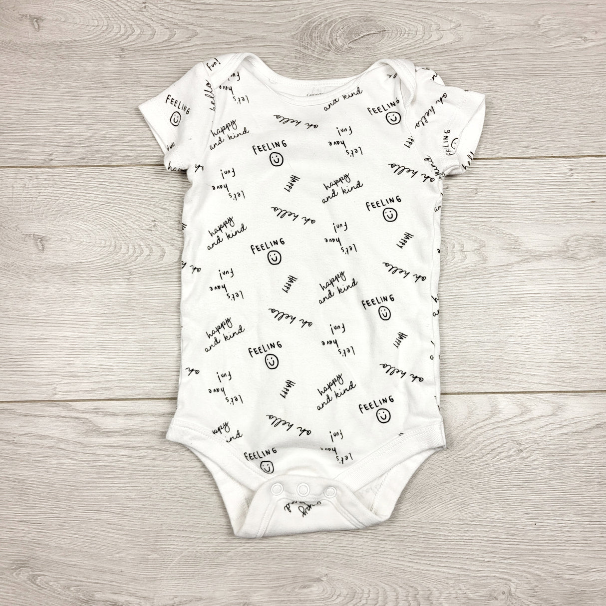 LMAC22 - George white bodysuit with happy phrases. Size 3-6 months