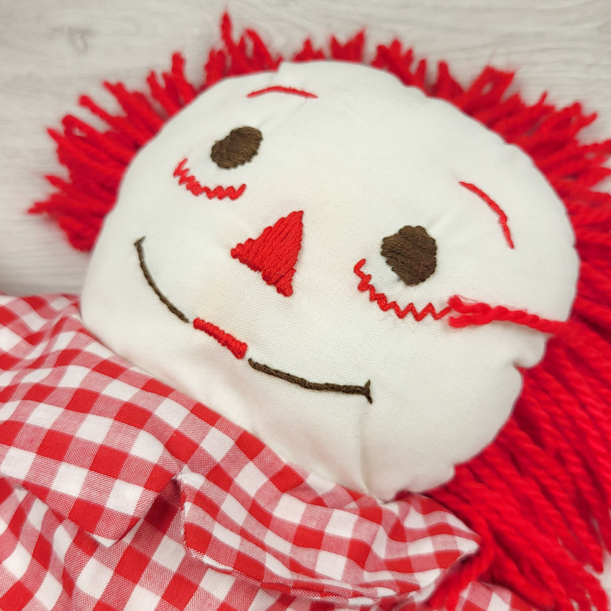 CBT1 - Handmade Raggedy Ann doll.  Marks on face