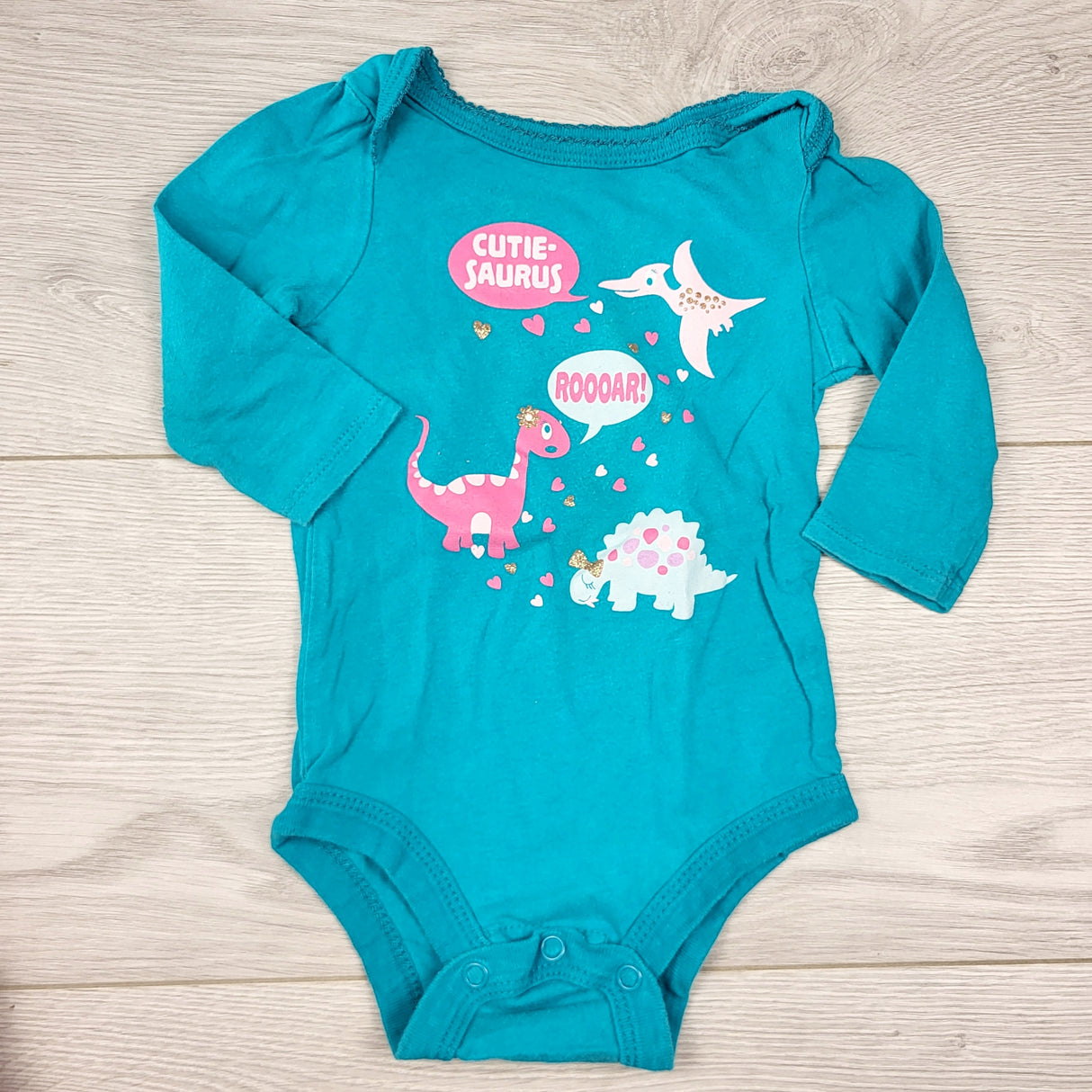 CCRT2 - George teal bodysuit with dinosaurs. Size 3-6 months