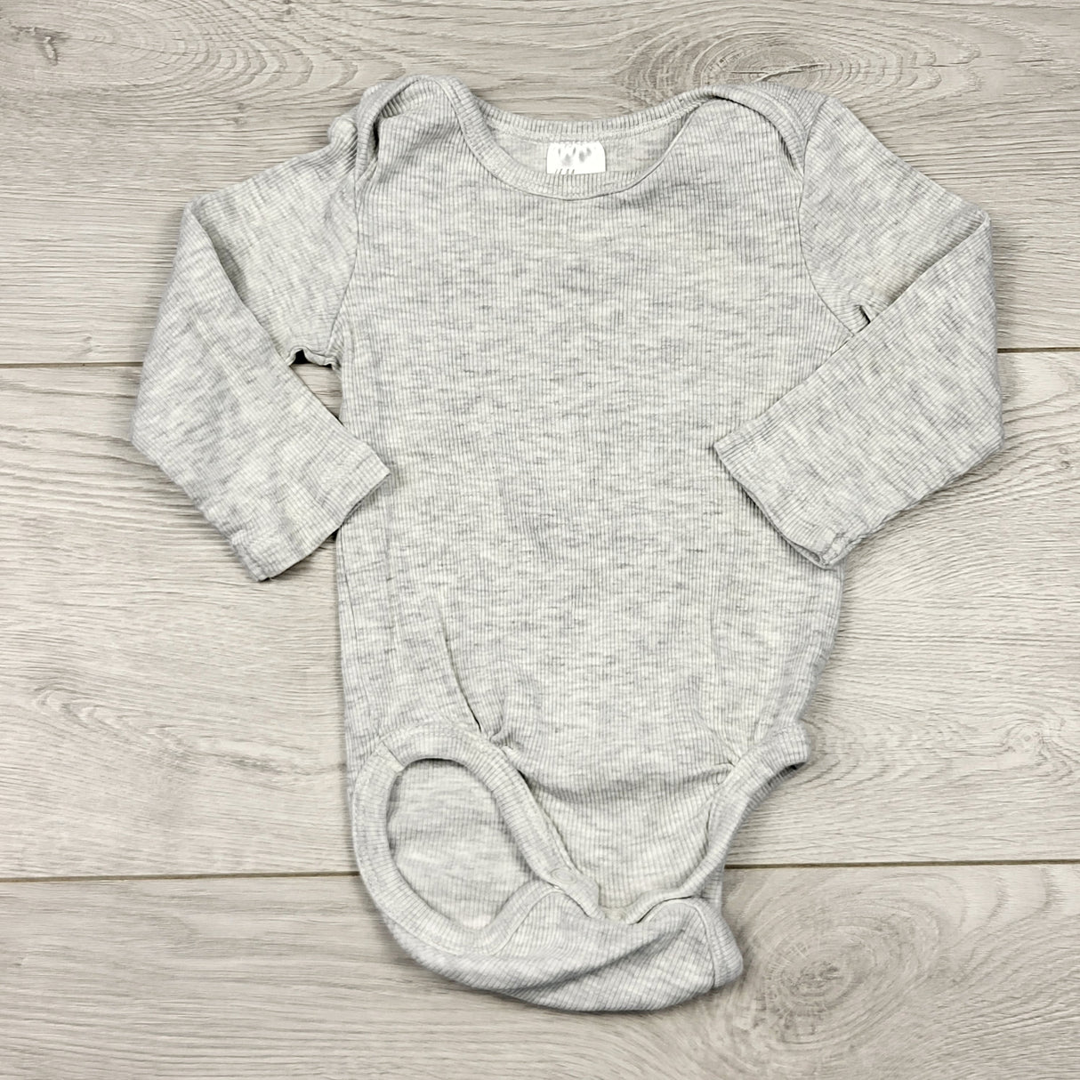 STFT22 - H and M grey ribbed bodysuit. Size 2-4 months