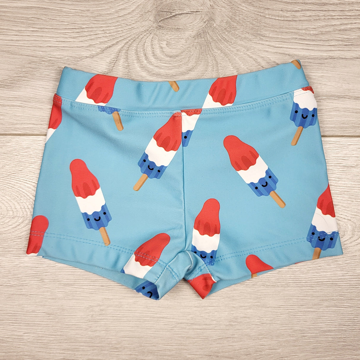 HWIL1 - Whistle and Flute Space Pop swim trunks. Size 6-12 months