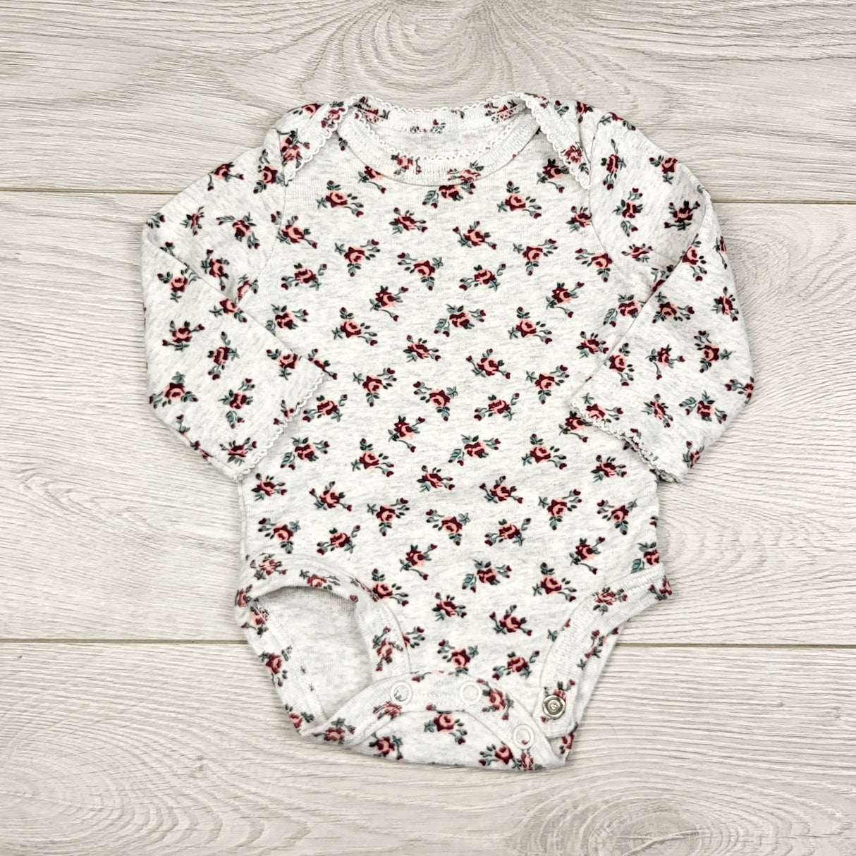 THNG11 - Carters grey floral print bodysuit. Newborn size