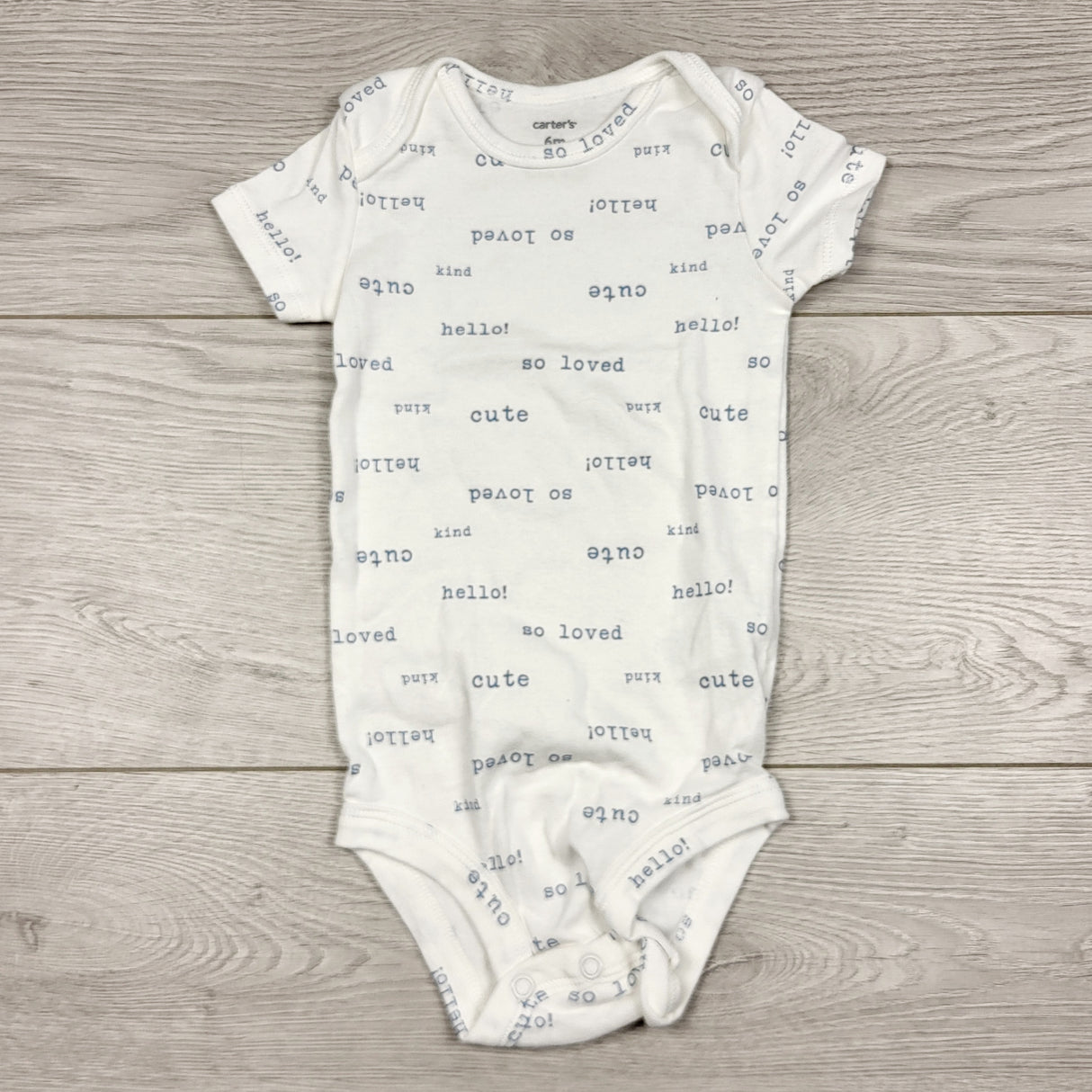 THNG21 - Carters white bodysuit with writing. Size 6 months