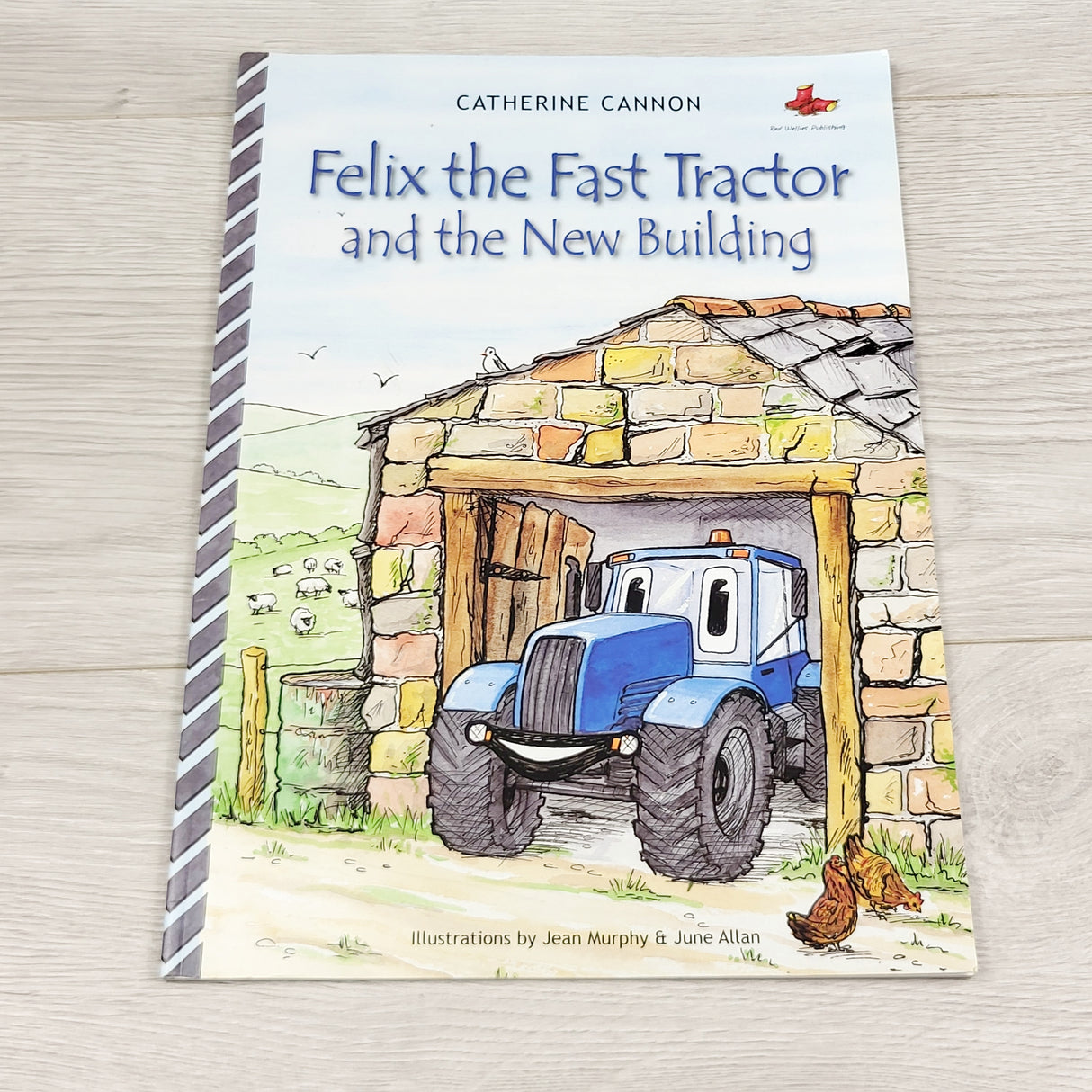 JLSN2 - Felix the Fast Tractor and the New Building. Soft cover book