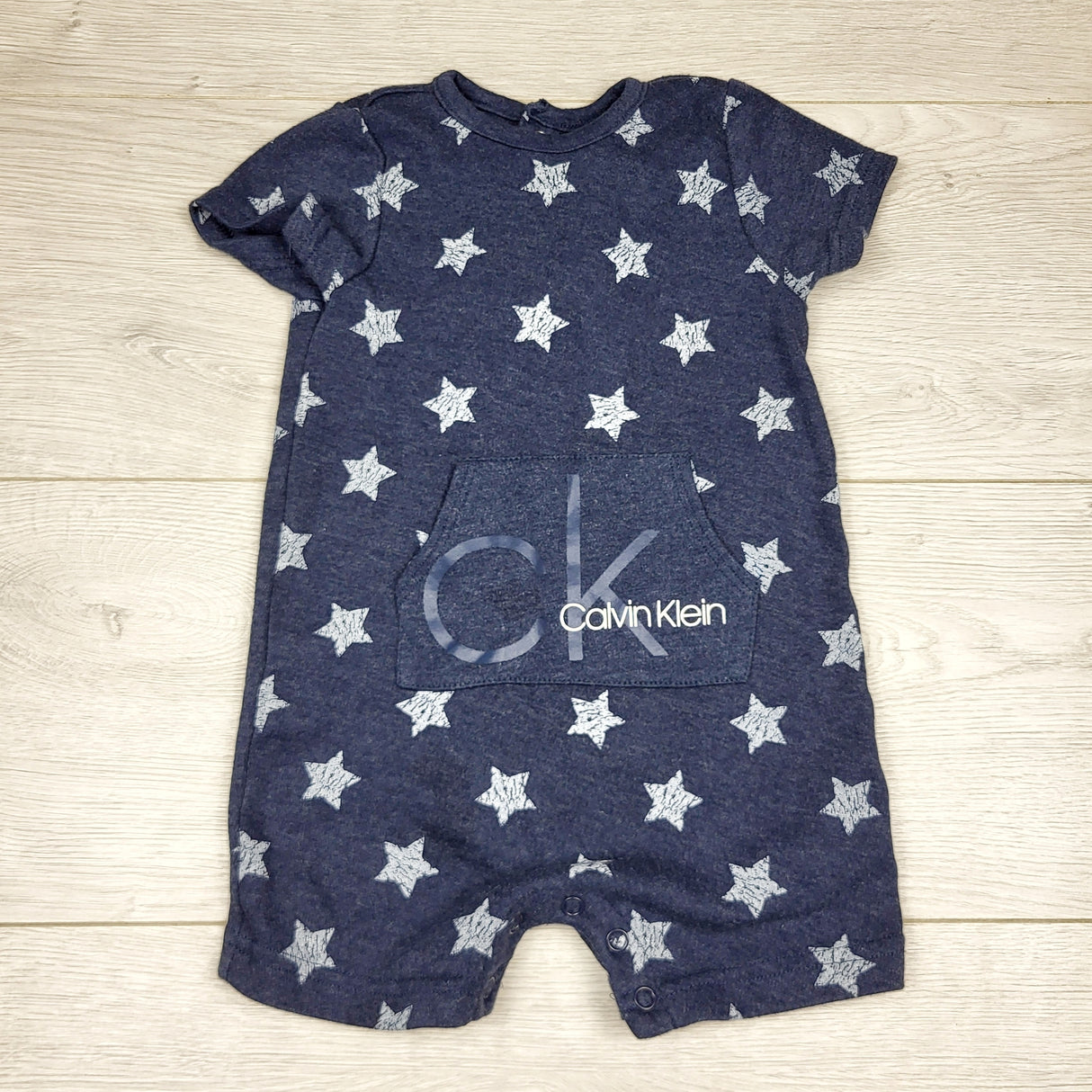 CHFF1 - Calvin Klein blue cotton romper with stars. Size 12 months