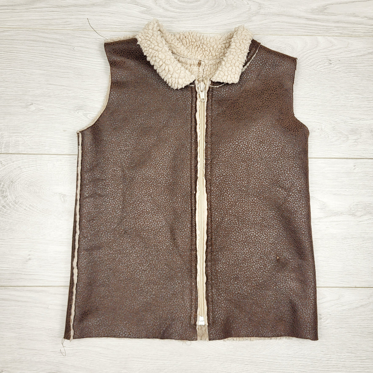 NGVU1- Brown faux sheepskin vest. Approx 4/5T