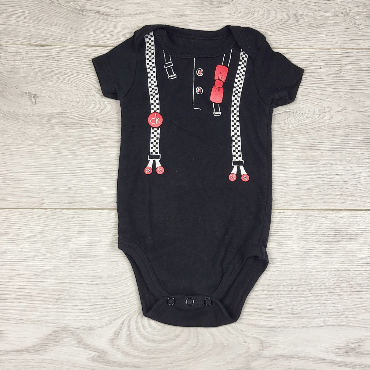 ADRT1 - Calvin Klein black cotton bodysuit with suspenders. Size 0-3 months