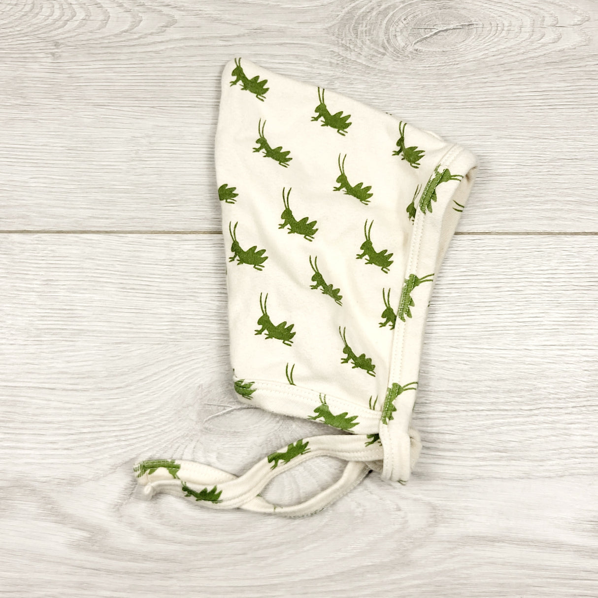 CCAM11 - Kate Quinn organic cotton bonnet with grasshoppers. Size 3-6 months