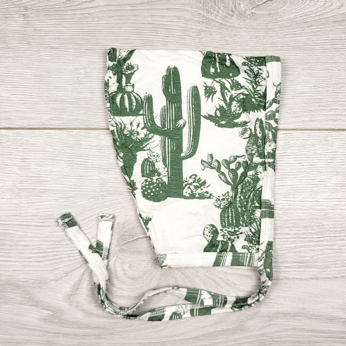 CCAM11 - Kate Quinn cactus printed bamboo bonnet. Size 3-6 months