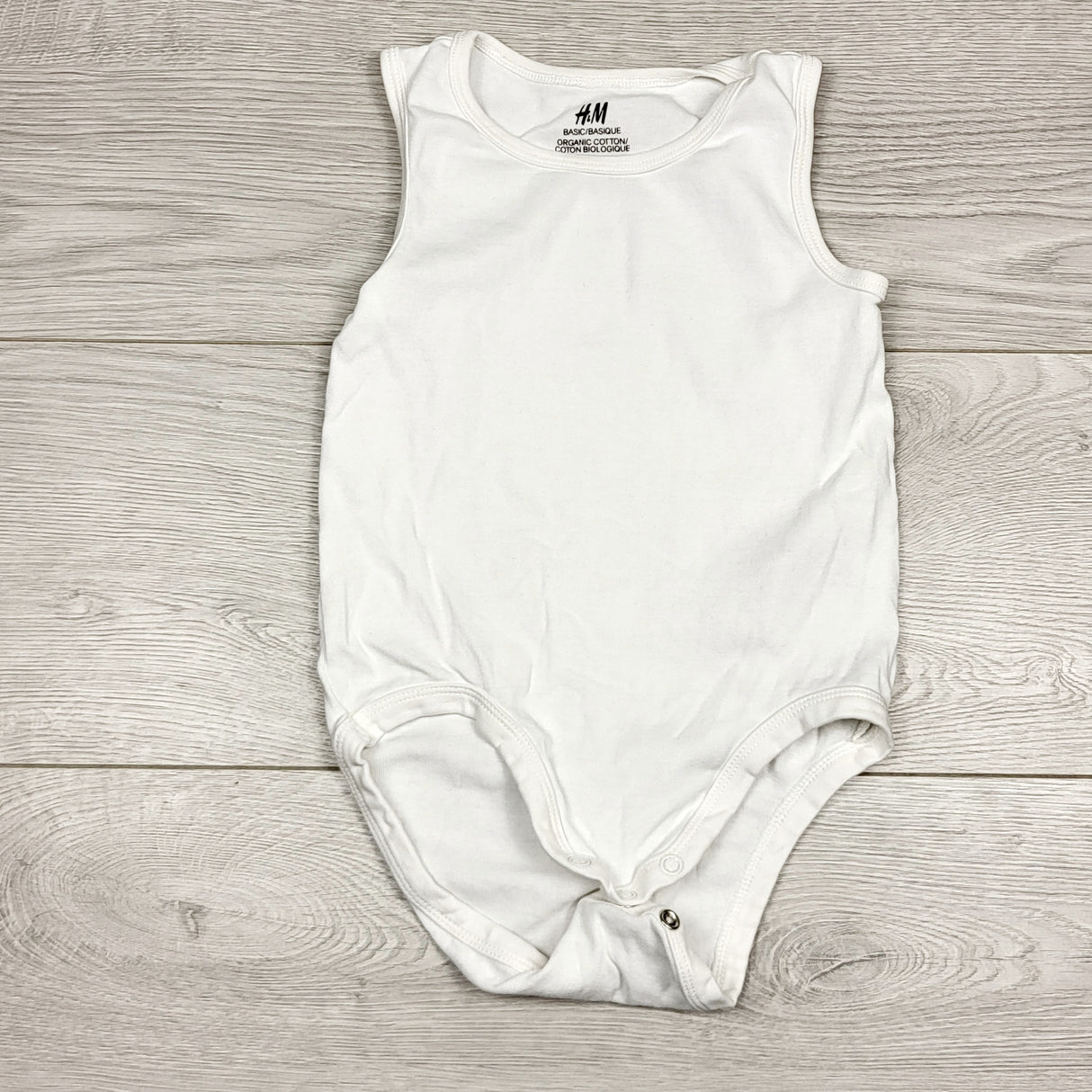 NKLB11 - H and M white tank style bodysuit. Size 2/3T