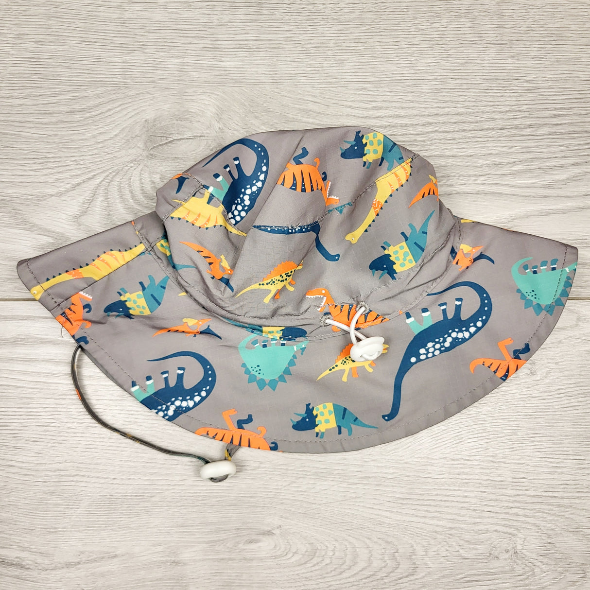 SMRSH1 - Grey bucket hat with dinosaurs. 50cm (2/3T)